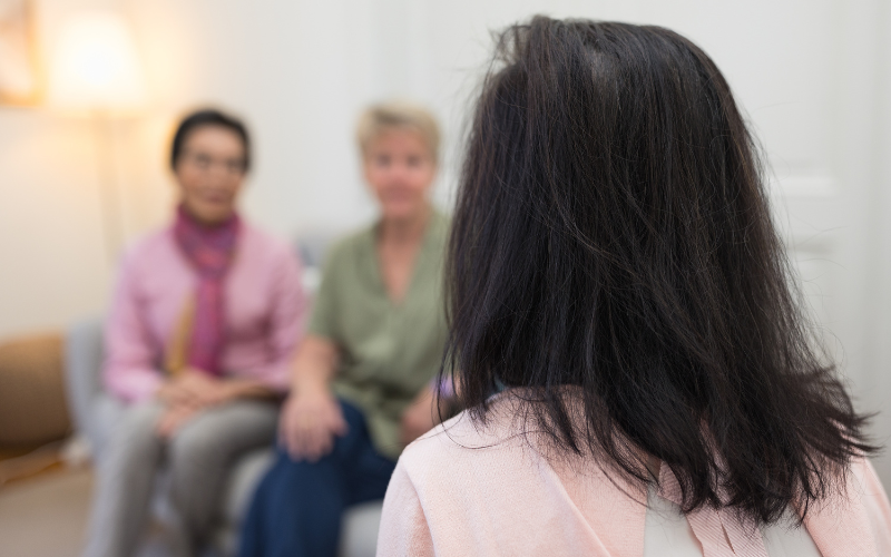 A picture of three people talking at the Cancer Support Switzerland Centre